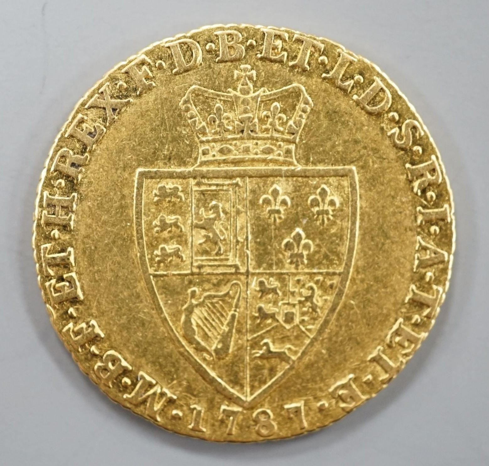 A 1787 gold spade guinea, Good F or better.